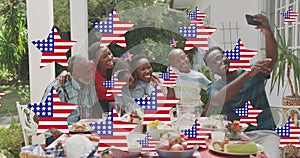 Image of stars with flag of united states of america waving over smiling african american family