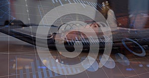 Image of statistical data processing against close up view of a open diary on office table