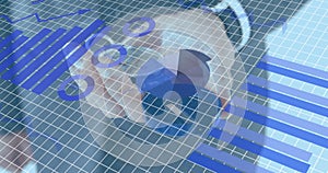 Image of statistics and data processing over caucasian businessman holding compass