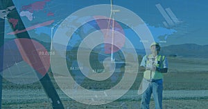 Image of statistics and data processing over wind turbines and engineer on blue background photo