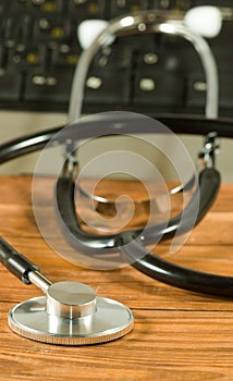 image of stethoscope and keyboardon the table close-up
