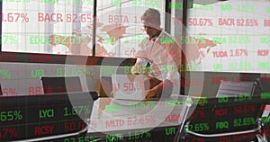 Image of stock market and world map over caucasian businessman