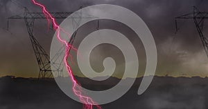 Image of storm with pink lightning and grey clouds over electric pylons