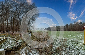 Image of a stream flowing through a winter forest