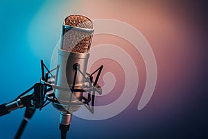 Image Studio podcast microphone on gradient blue background, broadcasting equipment photo