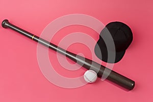 Image of Stylish Laquered Wooden Brown American Baseball Bat Placed With Clean Leather White Baseball Ball and Black Cap Over