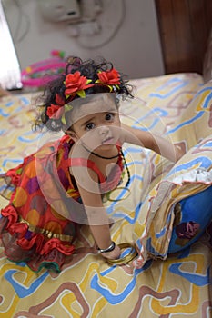 Image of sweet baby girl in a wreath, closeup portrait of cute 12 months old smiling girl, toddler, Adorable little baby girl,