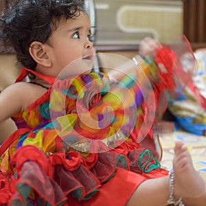 Image of sweet baby girl in a wreath, closeup portrait of cute 12 months old smiling girl, toddler, Adorable little baby girl, smi