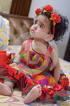 Image of sweet baby girl in a wreath, closeup portrait of cute 12 months old smiling girl, toddler, Adorable little baby girl, smi