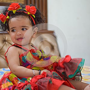 Image of sweet baby girl in a wreath, closeup portrait of cute 12 months old smiling girl, toddler, Adorable little baby girl, smi