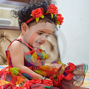 Image of sweet baby girl in a wreath, closeup portrait of cute 12 months old smiling girl, toddler, Adorable little baby girl, smi