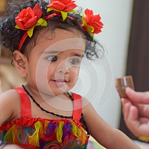 Image of sweet baby girl in a wreath, closeup portrait of cute 12 months old smiling girl, toddler, Adorable little baby girl, smi