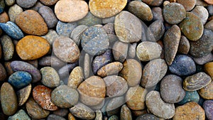 The image of a texture of stones could have multiple uses, could also be used as wallpaper.