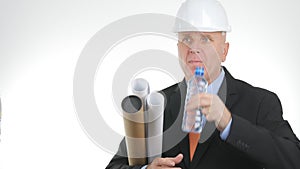 Image with a Thirsty Engineer Drinking Fresh Water from a Bottle