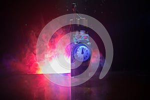 Image of a time bomb against dark background. Timer counting down to detonation illuminated in a shaft light shining through the