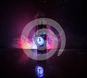 Image of a time bomb against dark background. Timer counting down to detonation illuminated in a shaft light shining through the