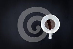 An image top view instant coffee powder in cup or mug white color is a drink beverage morning give energy on dark background with