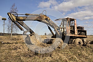 The image of the tractor in the mud