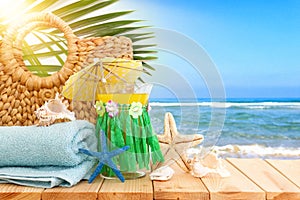 image of tropical and exotic fruit coctail over wooden table infront of sea landscape background