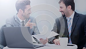 Image of two business people interacting at meeting in office