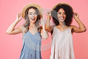 Image of two positive summer women with different color of skin