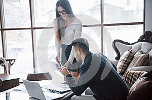 Image of two successful business partners working at meeting in office