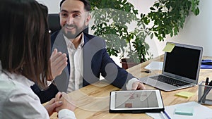 Image of two successful business partners working at meeting in office