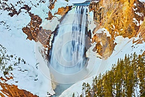 Up close to amazing Yellowstone Upper Falls in winter snow