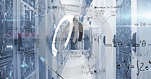 Image of uploading data roundel and maths calculations over computer server room photo