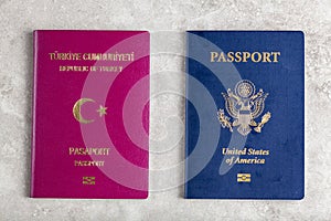 Image of a US passport and a Turkish passport side by side