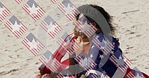 Image of usa flags over diverse women sitting on beach