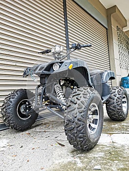 Image of used black in color all terrain vehicle. Selective focus.