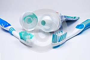 Image of used old and new toothbrushes isolated on a white backg