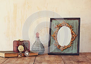 Image of victorian vintage antique classical frame, jewelry and perfume bottle