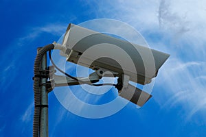 Video camera of an external security system with the sky in the background