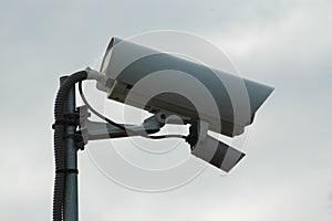 Outdoor video surveillance camera on a cloudy day photo