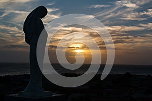 Image of the virgin Maria protecting from a hill the island of Coche, in the Venezuelan Caribbean. photo