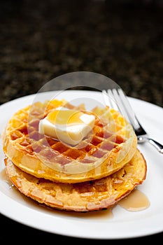 Image of waffles covered in maple syrup