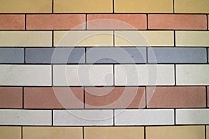 An image of a wall made from colorful bricks