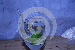 image of a water drop in a glass