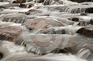 Image of a waterfall with cascade water flowing