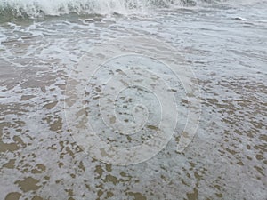 Image of the Wave of the sea on the sand beach photo