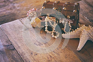 Image of white pearls necklace in treasure chest