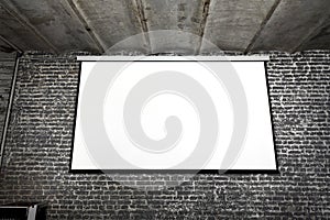 Image of white projector screen on gray brick wall