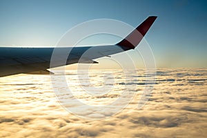 Image of wing of airplane and window.