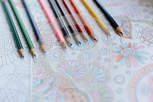 Image of woman coloring, adult coloring book trend, for stress r