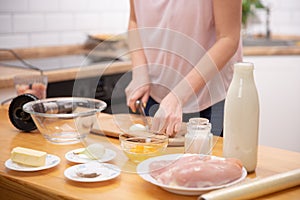 The image of a woman cutting onion