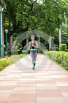 Image of Woman Jogging In Park