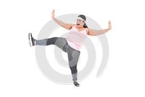 Image of a woman using hands and foot to push away unhealthy diet isolated on white background