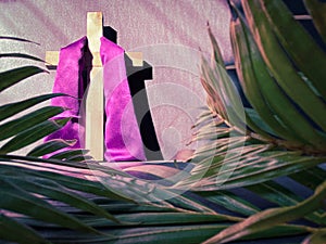 Image of wooden cross with stole in vintage background. Lent Season,Holy Week and Good Friday concepts. Stock photo.